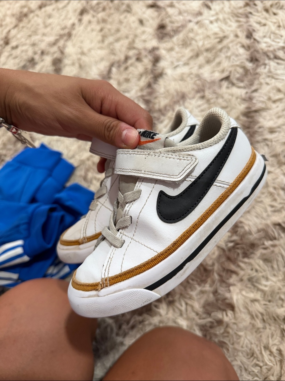 Nike Kids White Sneakers with Black Swoosh and Gold Trim